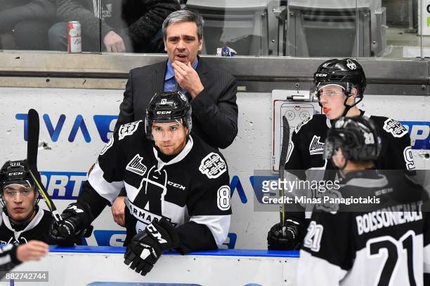 Head coach of the Blainville-Boisbriand Armada Joel Bouchard looks on against the Baie-Comeau Drakkar during the QMJHL game at Centre d'Excellence...
