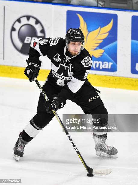 Michael Kemp of the Blainville-Boisbriand Armada skates the puck against the Baie-Comeau Drakkar during the QMJHL game at Centre d'Excellence Sports...