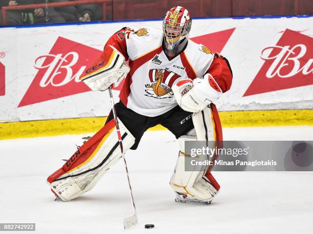 Goaltender Antoine Samuel of the Baie-Comeau Drakkar looks to play the puck against the Blainville-Boisbriand Armada during the QMJHL game at Centre...