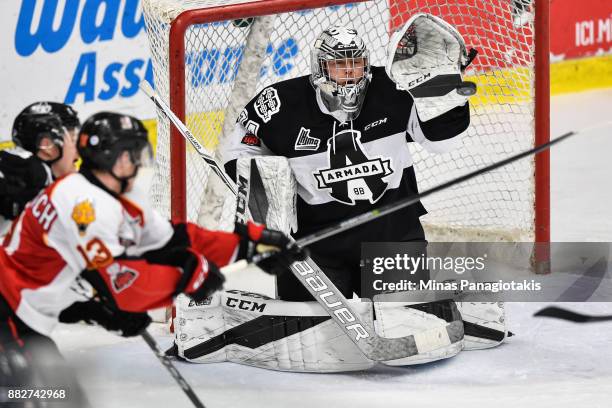 Goaltender Francis Leclerc of the Blainville-Boisbriand Armada gets the glove up to stop the puck against the Baie-Comeau Drakkar during the QMJHL...