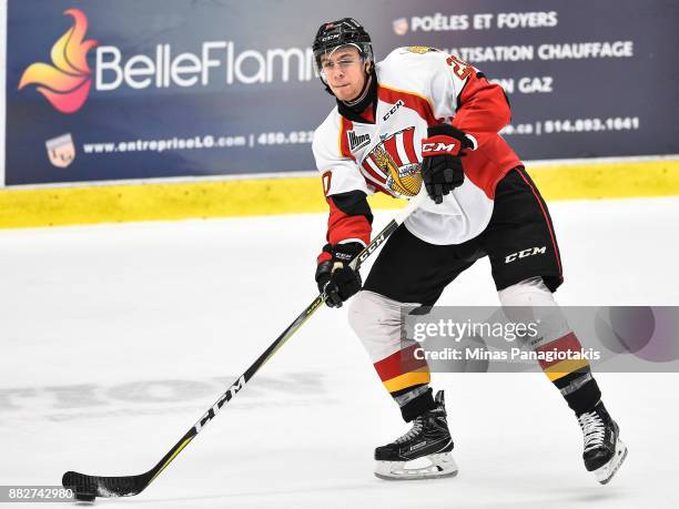 Xavier Bouchard of the Baie-Comeau Drakkar looks to play the puck against the Blainville-Boisbriand Armada during the QMJHL game at Centre...