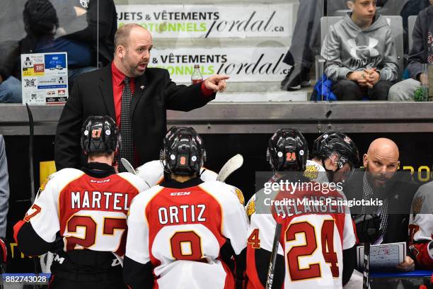 Head coach of the Baie-Comeau Drakkar Martin Bernard instructs his players against the Blainville-Boisbriand Armada during the QMJHL game at Centre...