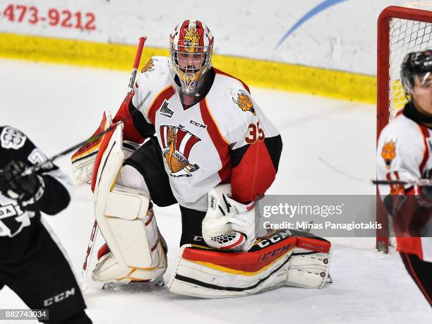 Antoine Samuel of the Baie-Comeau Drakkar protects his net against the Blainville-Boisbriand Armada during the QMJHL game at Centre d'Excellence...