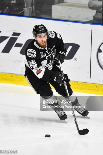 Pascal Corbeil of the Blainville-Boisbriand Armada skates the puck against the Baie-Comeau Drakkar during the QMJHL game at Centre d'Excellence...
