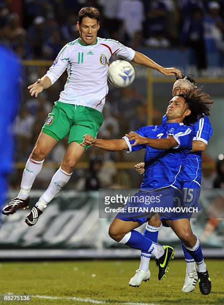 Mexico's Guillermo Franco vies for the ball with El Salvador's Alexander Escobar during their FIFA World Cup South Africa-2010 qualifier football...