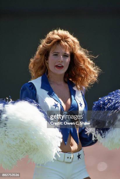 Dallas cowboys Cheerleader cheers on her team against the Los Angeles Rams at Anaheim Stadium circa 1984 in Anaheim,California on September 3rd 1984.