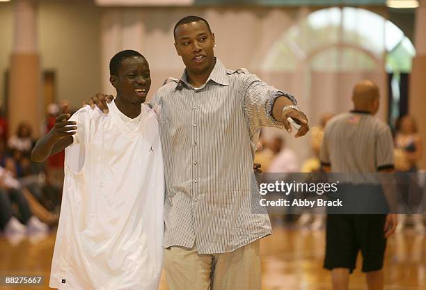 Michael Blackson and Caron Butler attend Big Tigger's 8th Annual Celebrity Classic Benefiting HIV/AIDS Awareness at Trinity University Gymnasium on...