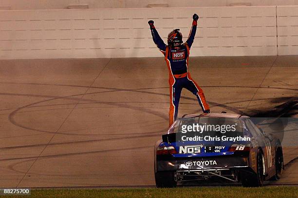 Kyle Busch, driver of the NOS Energy Drink Toyota celebrates after winning the NASCAR Nationwide Series Federated Auto Parts 300 at the Nashville...
