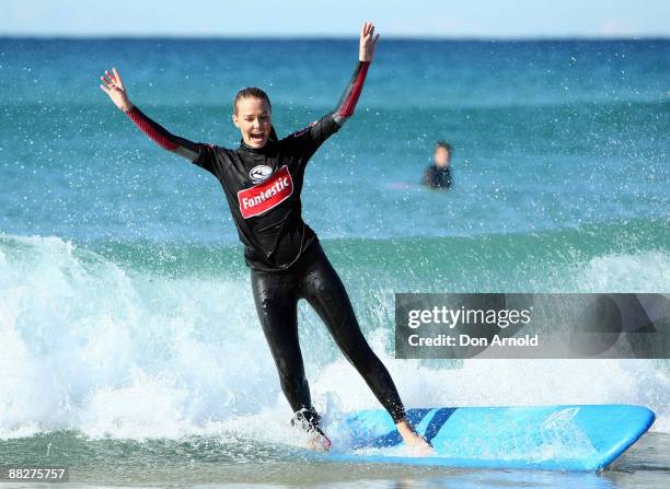 Lara Bingle displays her surfing skills during the Celebrity Drop In for new surfing TV series 'Next Wave' at Maroubra Beach on June 6, 2009 in...