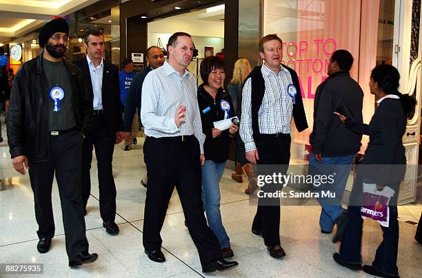 New Zealand Prime Minister John Key, National MP Melissa Lee and Jonathan Coleman campaign at the St Luke shopping centre on June 7, 2009 in...