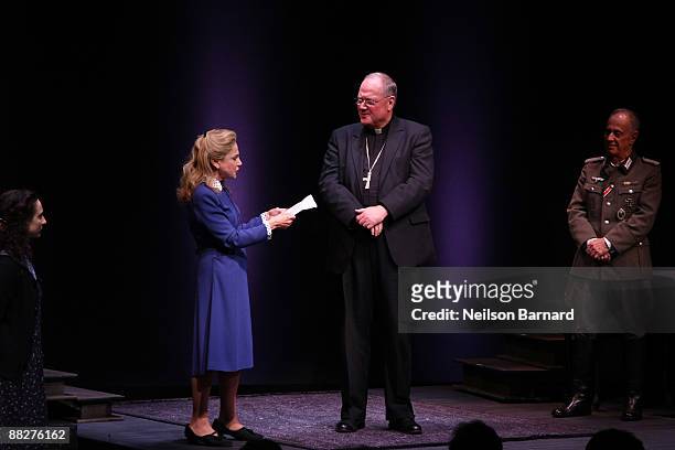 Archbishop Timothy Dolan and actress Tovah Feldshuh appear on stage for the curtain call of "Irena's Vow" at Walter Kerr Theatre on June 6, 2009 in...