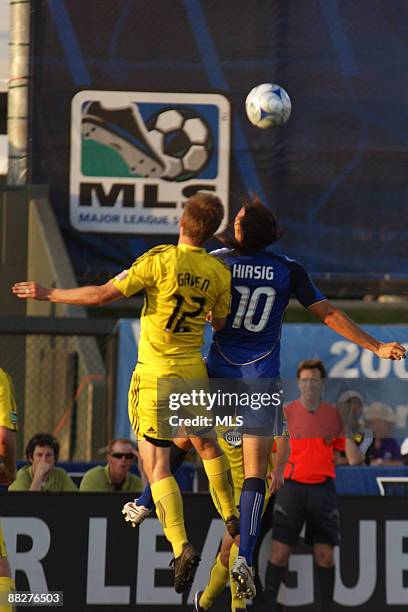 Eddie Gaven of the Columbus Crew competes for a header with Santiago Hirsig of the Kansas City Wizards during the game at Community America Ballpark...