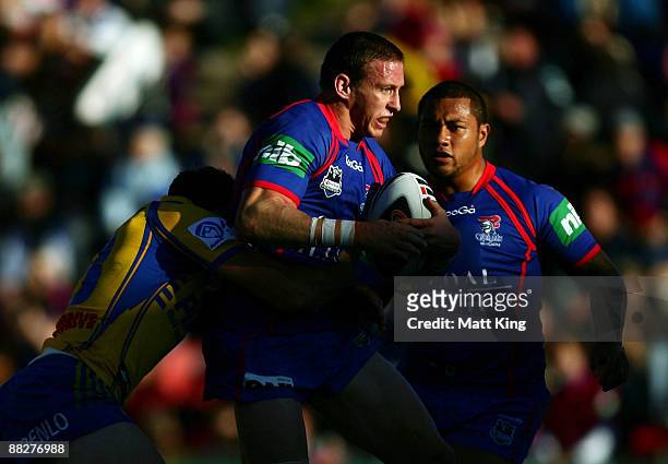 Kurt Gidley of the Knights is tackled during the round 13 NRL match between the Newcastle Knights and the Parramatta Eels at EnergyAustralia Stadium...