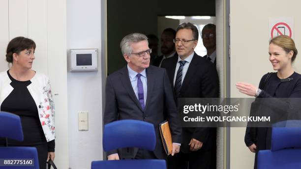 German Interior Minister Thomas de Maiziere and the head of the Federal Criminal Police Office , Holger Muench arrive for a meeting at the Joint...