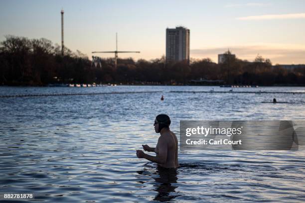 Member of the Serpentine Swimming Club enjoys an early morning swim in Serpentine Lake in Hyde Park on November 30, 2017 in London, England. Today...