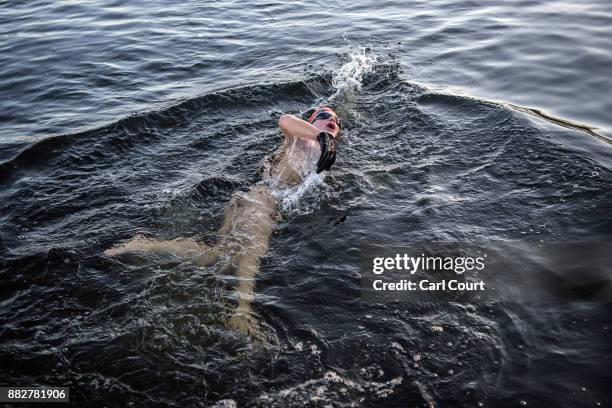 Member of the Serpentine Swimming Club enjoys an early morning swim in Serpentine Lake in Hyde Park on November 30, 2017 in London, England. Today...
