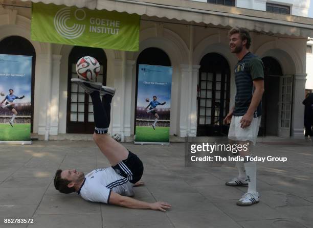 Max Meyer and Daniel Korte, Freestyle footballers from Germany perform during an event in New Delhi.