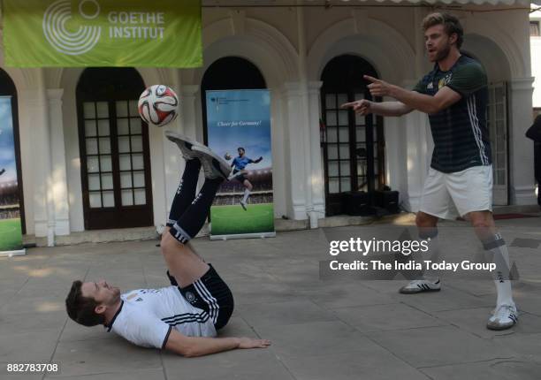 Max Meyer and Daniel Korte, Freestyle footballers from Germany perform during an event in New Delhi.