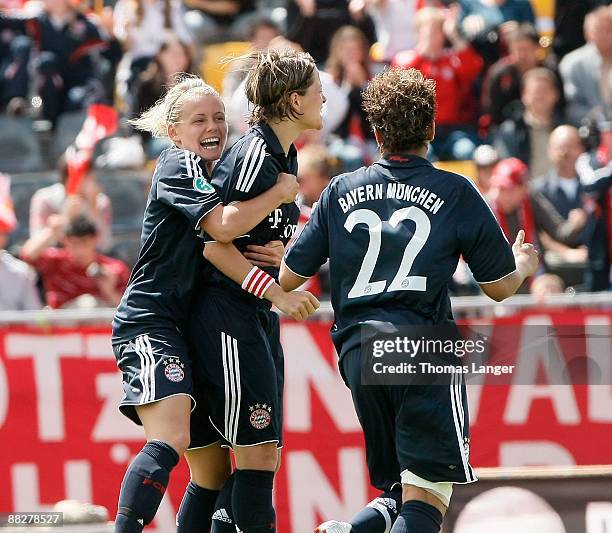 Julia Simic, Bianca Rech and Sylvie Banecki of Muenchen celebrate Rech's 1-0 goal during the Women's Bundesliga match between FC Bayern Muenchen and...