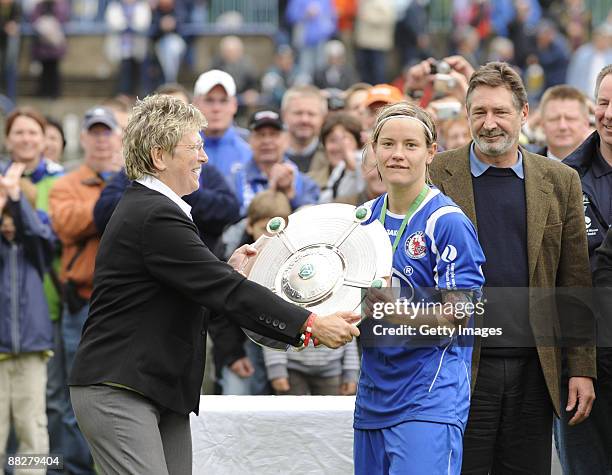 Margit Stoppa presents Jennifer Zietz with the trophy after the Women Bundesliga match between FFC Turbine Potsdam and VfL Wolfsburg at the...