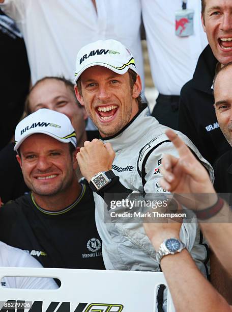 Jenson Button of Great Britain and Brawn GP celebrates with team mates in the paddock after winning the Turkish Formula One Grand Prix at Istanbul...