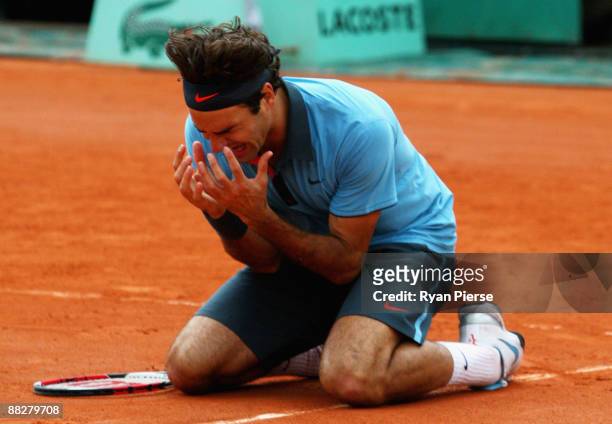 Roger Federer of Switzerland falls to his knees as he celebrates victory during the Men's Singles Final match against Robin Soderling of Sweden on...