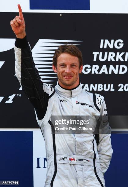 Jenson Button of Great Britain and Brawn GP celebrates on the podium after winning the Turkish Formula One Grand Prix at Istanbul Park on June 7 in...