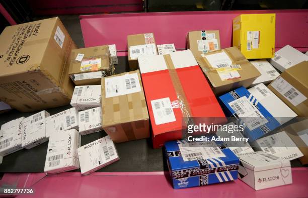Packages lie ready for sorting at a Deutsche Post postal distribution center on November 30, 2017 in Rudersdorf, Germany. Deutsche Post DHL Group...
