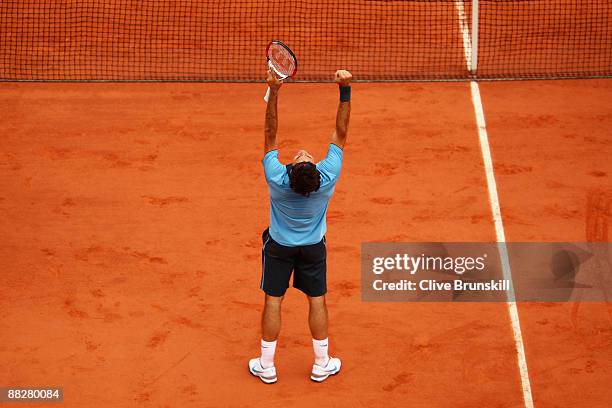 Roger Federer of Switzerland celebrates victory during the Men's Singles Final match against Robin Soderling of Sweden on day fifteen of the French...