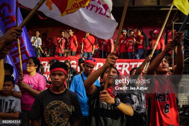 Filipino leftist protesters march against President Rodrigo Duterte on the streets on November 30, 2017 in Manila, Philippines. After announcing his...