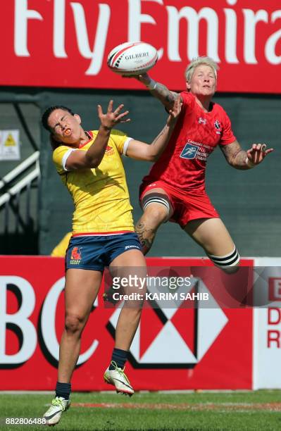 Canada's Jen Kish tackles Spain's Maria Ribera during the Women's Sevens World Dubai Series rugby union match in the Gulf emirate of Dubai on...