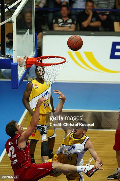 Milan Majstorovic of Oldenburg shoots over Beckham Wyrick of Brose Baskets Bamberg during the Basketball Bundesliga Play-Off match between EWE...