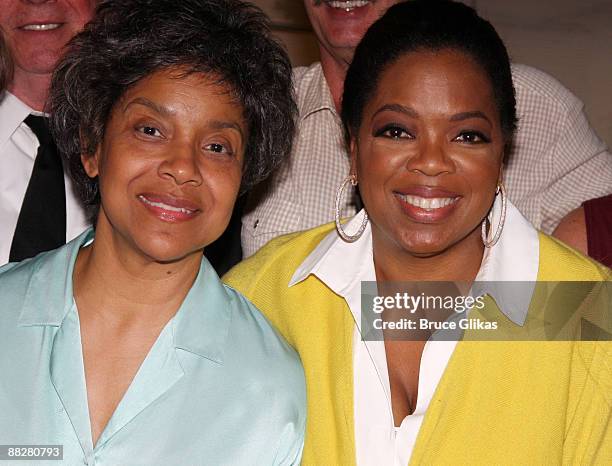 Actress Phylicia Rashad , dressed as her character "Violet Weston", and talk show host Oprah Winfrey pose backstage at the Pulitzer Prize-winning...