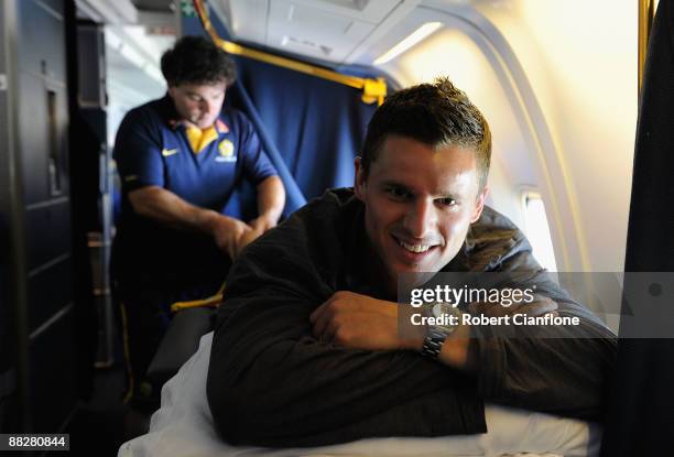 Jason Culina of Australia is treated by team massuer Luke Atwell as the Socceroos depart from Qatar after qualifying for the 2010 FIFA World Cup on...