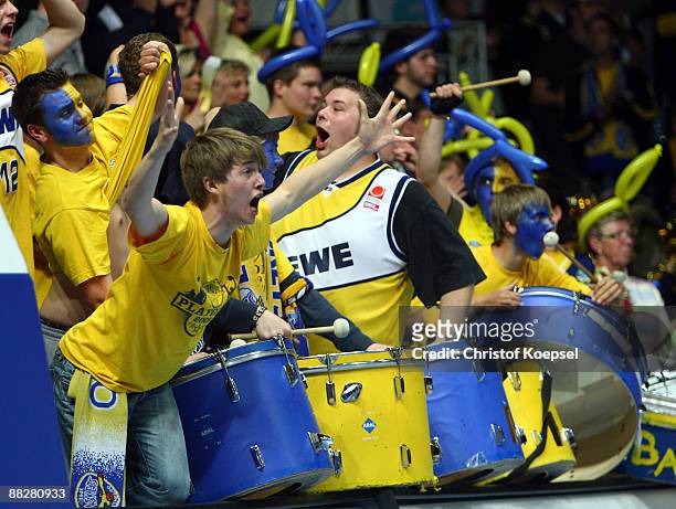 The fans of Oldenburg cheer their team during the Basketball Bundesliga Play-Off match between EWE Baskets Oldenburg and Brose Baskets Bamberg at the...