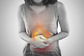 The Photo Of Fire Is On The Woman's Body. People With Stomach Ache Problem Concept. Female Anatomy