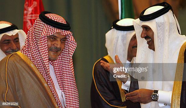 Saudi Foreign Minister Prince Saud al-Faisal shares a laugh with his Qatari counterpart Sheikh Hamad bin Jassem bin Jabr al-Thani during a meeting in...