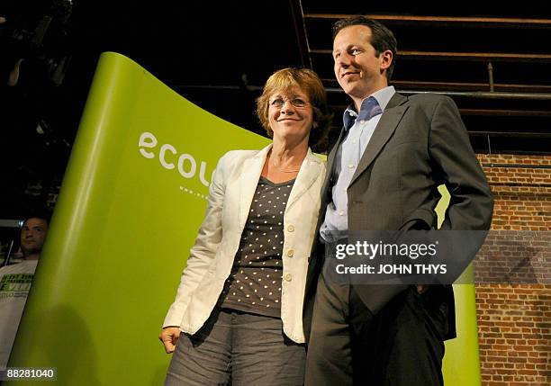 Belgian politicians, member of the Ecologist party called 'Ecolo', Isabelle Durant and Jean-Michel Javaux smile on the podium on the European and...