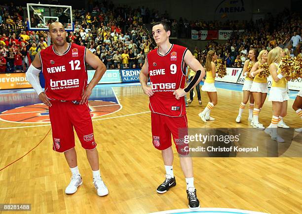 Robert Garrett and Karsten Tadda of Brose Baskets Bamberg look dejected after losing 85-88 the Basketball Bundesliga Play-Off match between EWE...