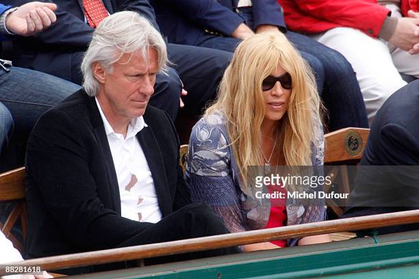 Former tennis player Bjorn Borg and a guest attend the French Open at Stade Roland Garros on June 7, 2009 in Paris, France.