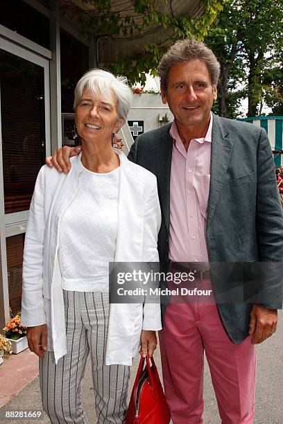 Economy, Industry and Employment Minister Christine Lagarde and her husband attend the French Open at Stade Roland Garros on June 7, 2009 in Paris,...