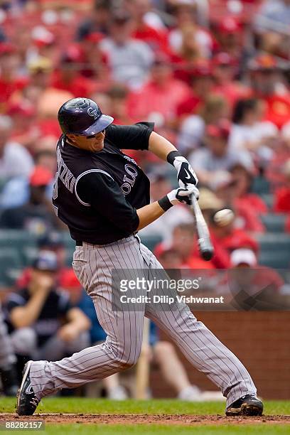 Troy Tulowitzki of the Colorado Rockies hits an RBI single against the St. Louis Cardinals on June 7, 2009 at Busch Stadium in St. Louis, Missouri....