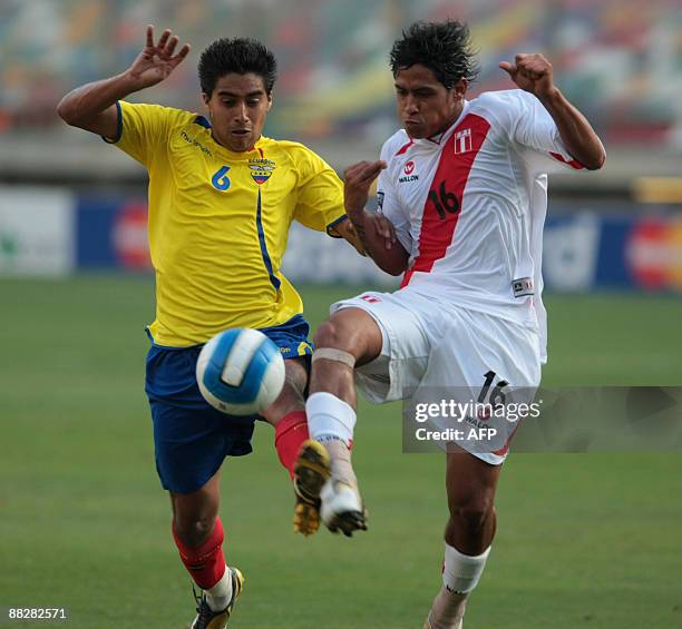 Cristian Noboa from Ecuador vies for the ball with Peru's Paolo de la Haza during their FIFA World Cup South Africa-2010 qualifier football match at...