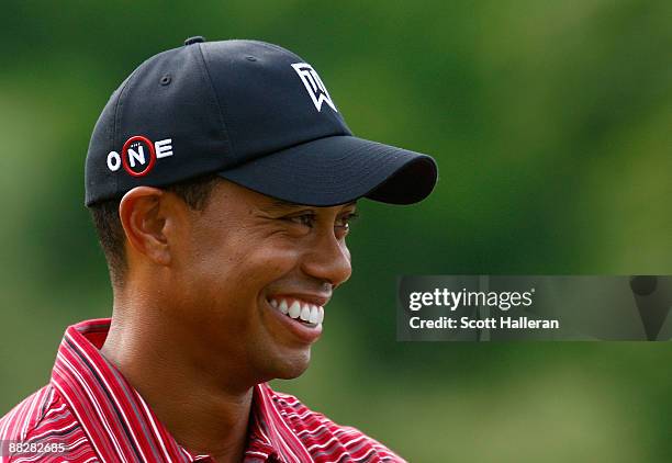 Tiger Woods waits on the 18th green after a one-stroke victory at the Memorial Tournament at the Muirfield Village Golf Club on June 7, 2009 in...