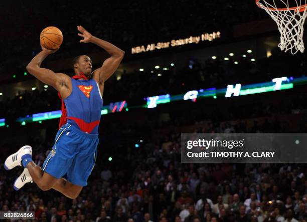 Dwight Howard of the Orlando Magic jumps wearing a Superman Cape in the Sprite Slam-Dunk Contest at the New Orleans Arena during the 2008 NBA...