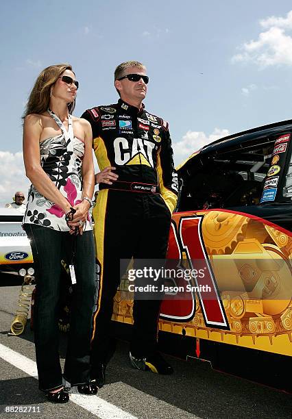 Jeff Burton, driver of the Caterpillar Chevrolet stands with wife Kim, prior to the start of the NASCAR Sprint Cup Series Pocono 500 on June 7, 2009...