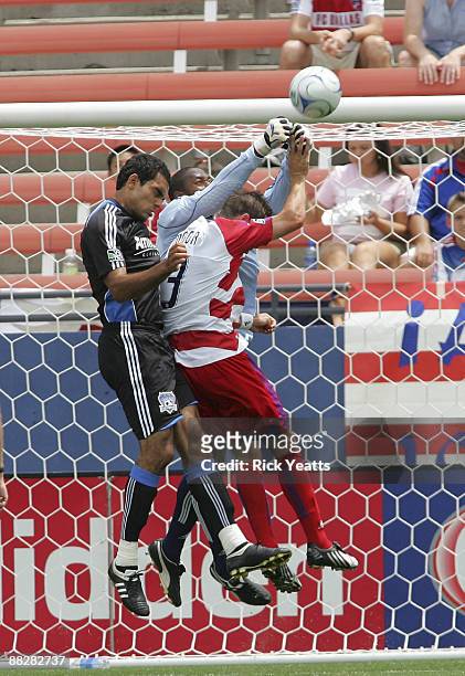 Ray Burse of the FC Dallas blocks a shot surrounded by Drew Moor of the FC Dallas and Pablo Campos of the San Jose Earthquakes at Pizza Hut Park on...