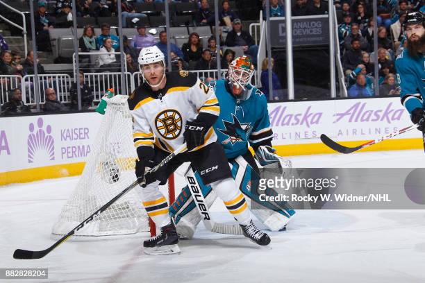 Jordan Szwarz of the Boston Bruins skates against Aaron Dell of the San Jose Sharks at SAP Center on November 18, 2017 in San Jose, California.