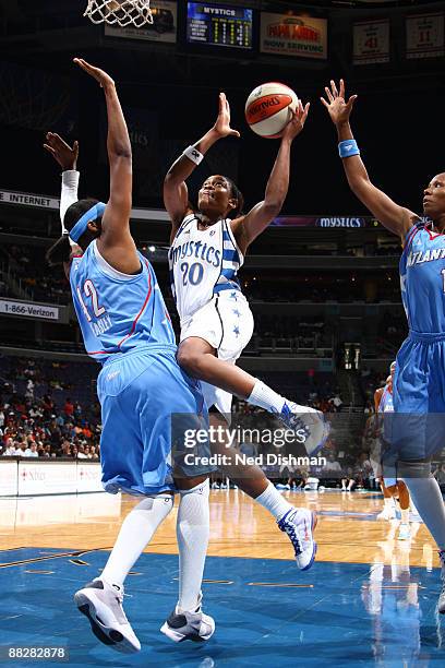 Alana Beard of the Washington Mystics shoots against Nikki Teasley of the Atlanta Dream at the Verizon Center on June 7, 2009 in Washington, DC. NOTE...