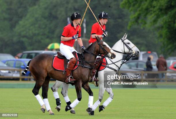 Prince William and Prince Harry attend a charity polo match at Cirencester Park Polo Club on June 7, 2009 in Cirencester, England.